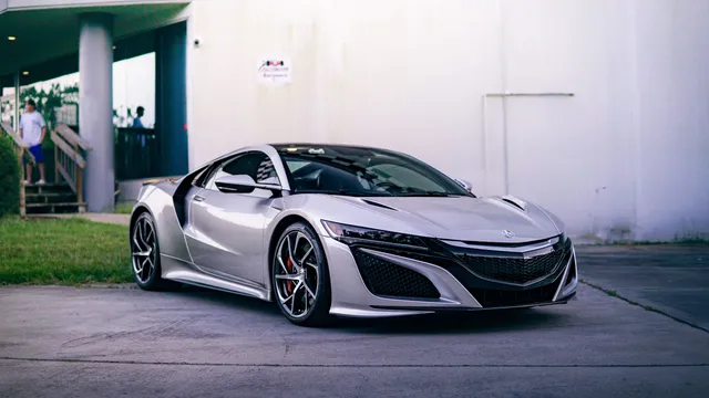 A silver Acura NSX sports car