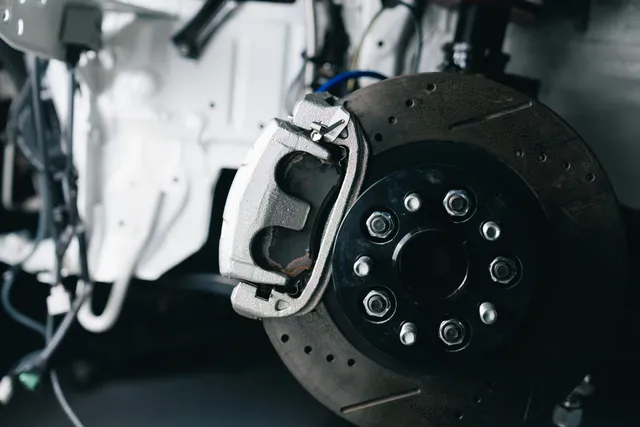 A brake disc and caliper mounted on a vehicle hub