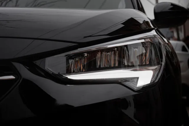Close crop of an LED headlight unit on a dark vehicle