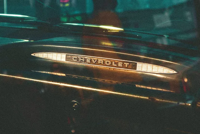 A Chevrolet badge on a car body