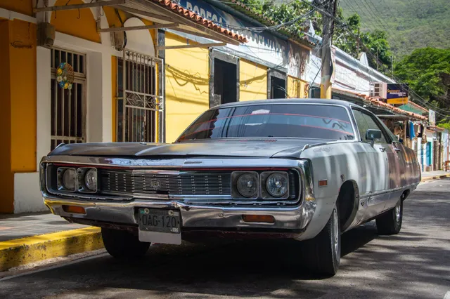 A classic Chrysler sedan parked on a street