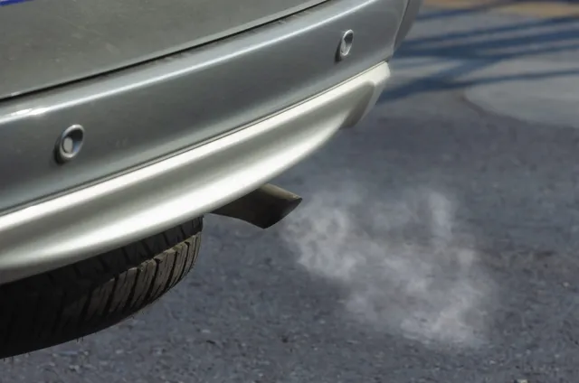Exhaust gas visible at the tailpipe of a running vehicle