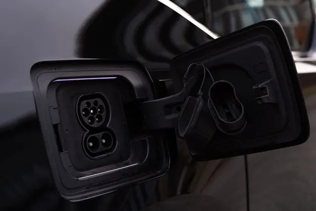 An electric vehicle charge port with the flap open