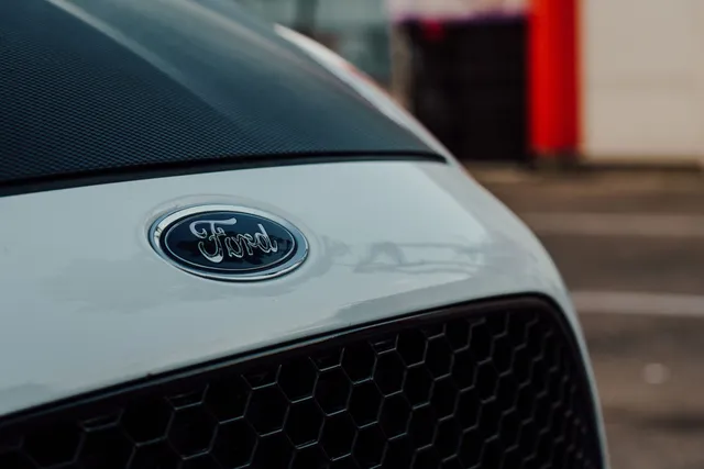 A Ford badge on the grille of a modern car