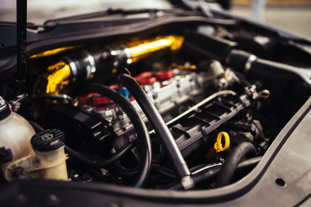 Fuel lines and intake plumbing in an engine bay