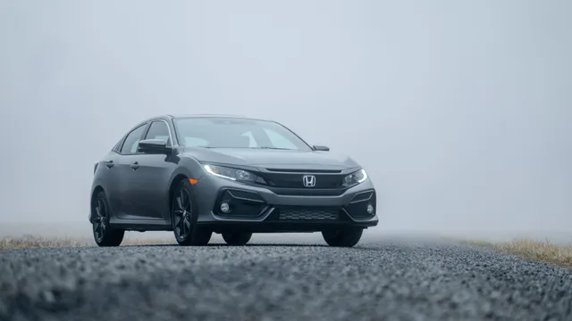 A gray Honda Civic against a plain background