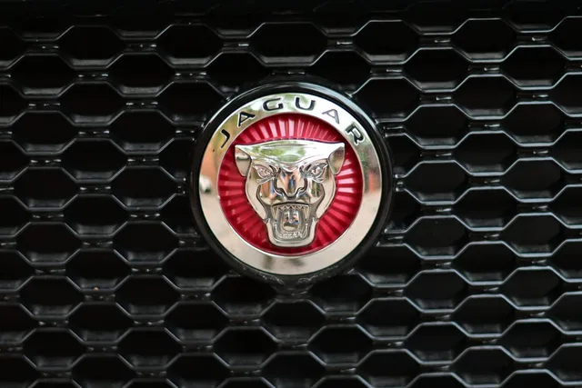 A Jaguar badge on a car grille