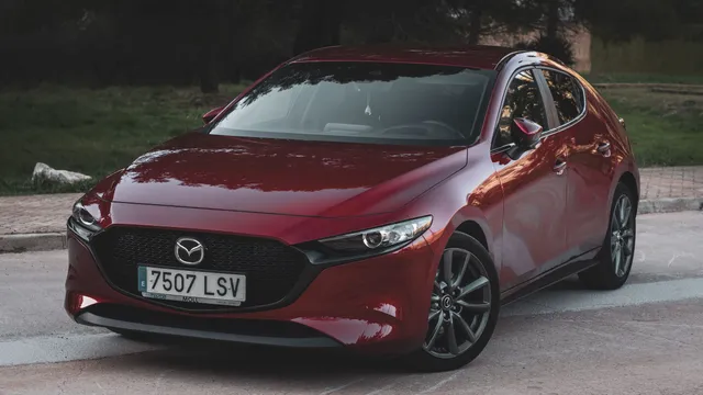 A red Mazda3 hatchback