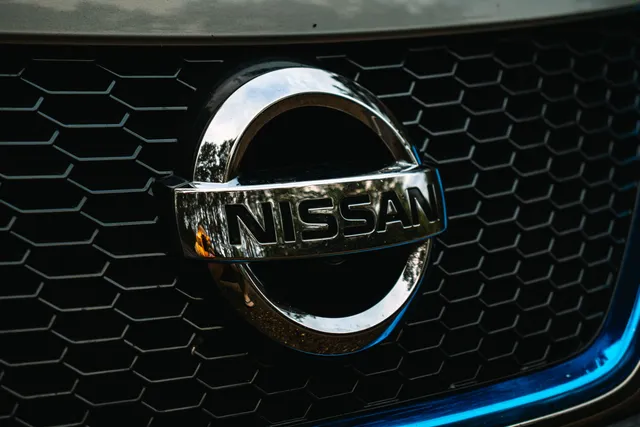 A Nissan badge on a car grille