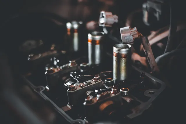 Close detail of ignition components on top of an engine